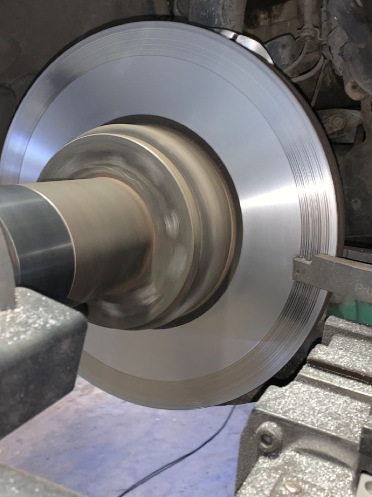 Cutting tool working across the face of a spinning brake disc